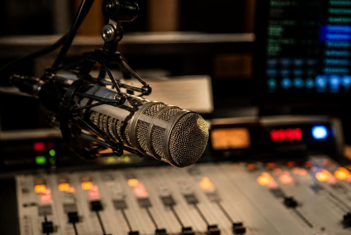 Broadcast microphone and mixing console in a radio production studio